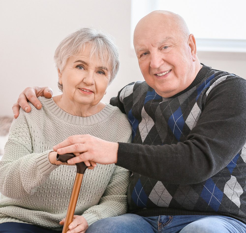 Senior couple sitting together comfortably at home
